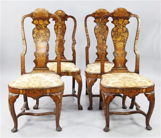 A set of three 18th century Dutch floral marquetry and walnut dining chairs, (4)